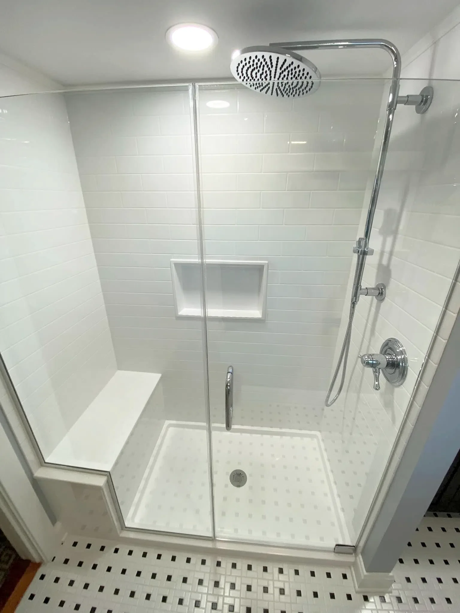 Shower remodel with rain shower head and corner seat