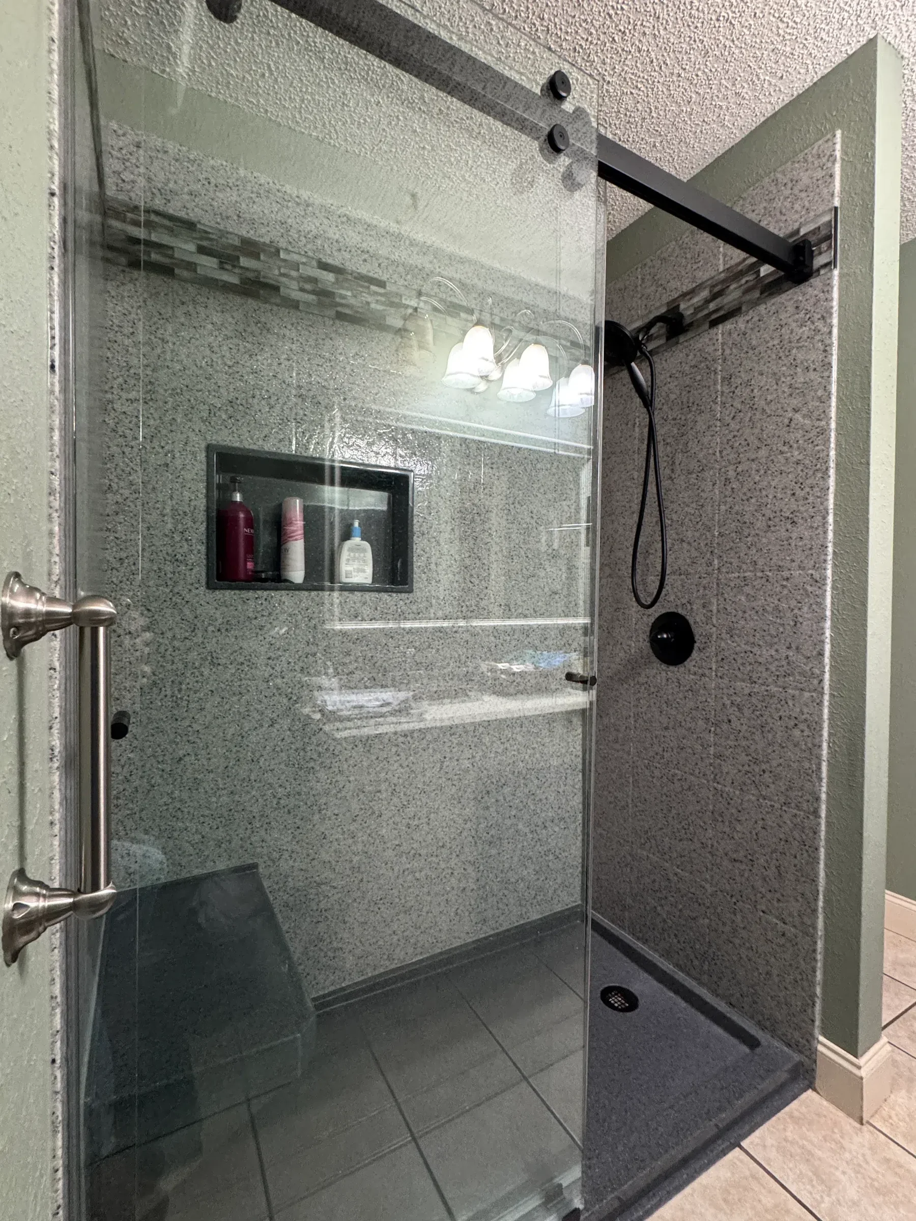 Frameless glass stone shower remodel